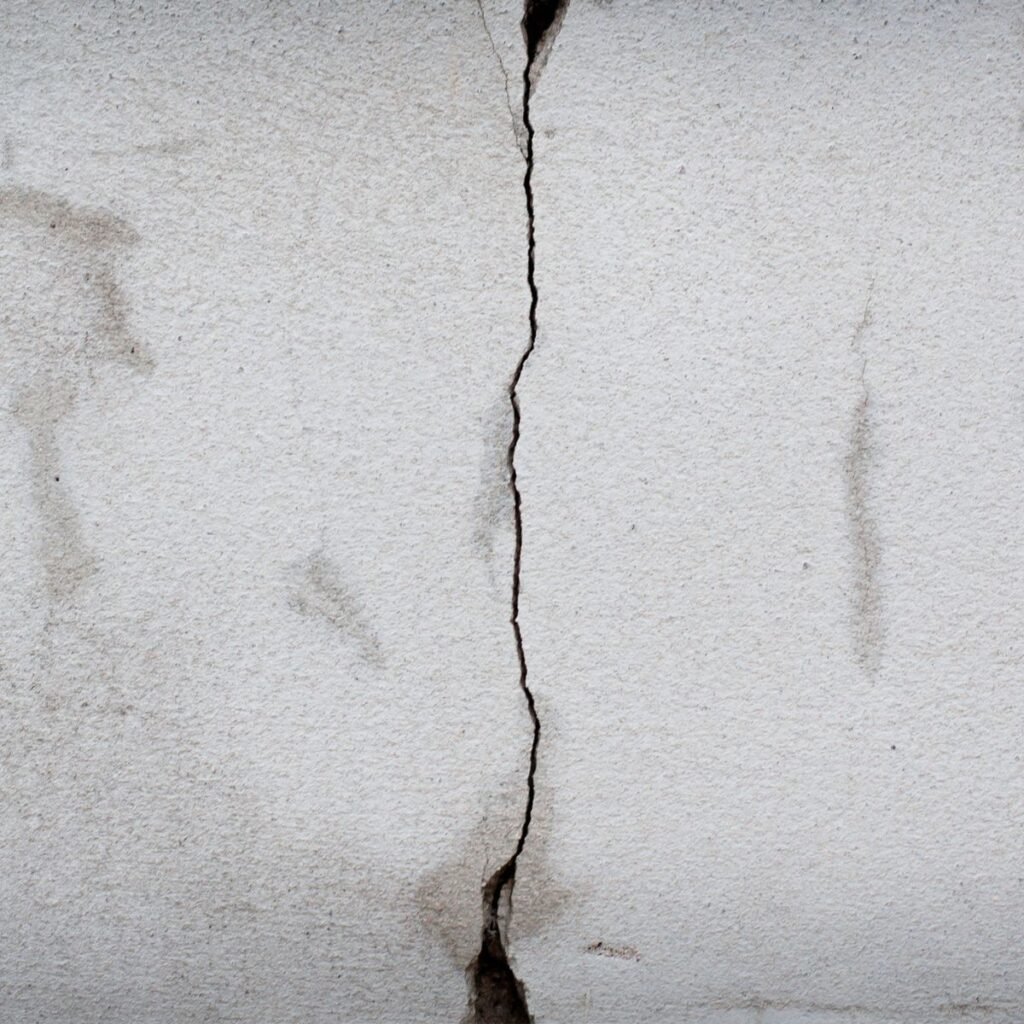crack in a concrete slab. Vertical crack
