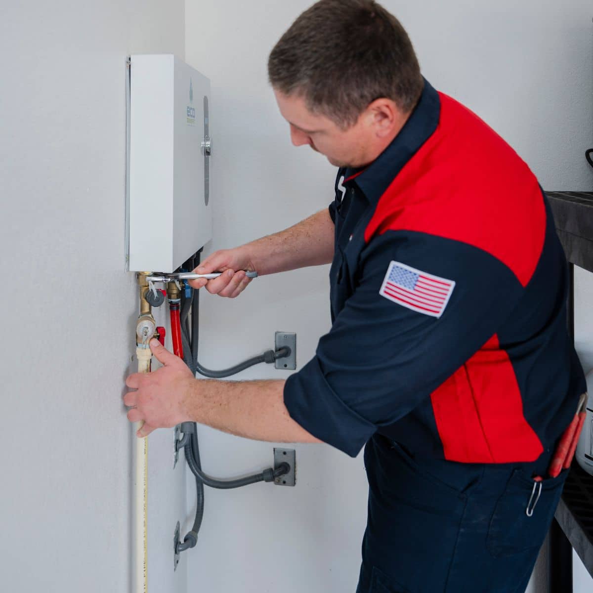 service squad tech installing a tankless water heater