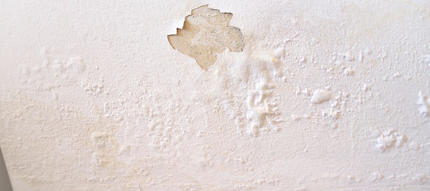 sheet rock bubbling on a ceiling due to a leak