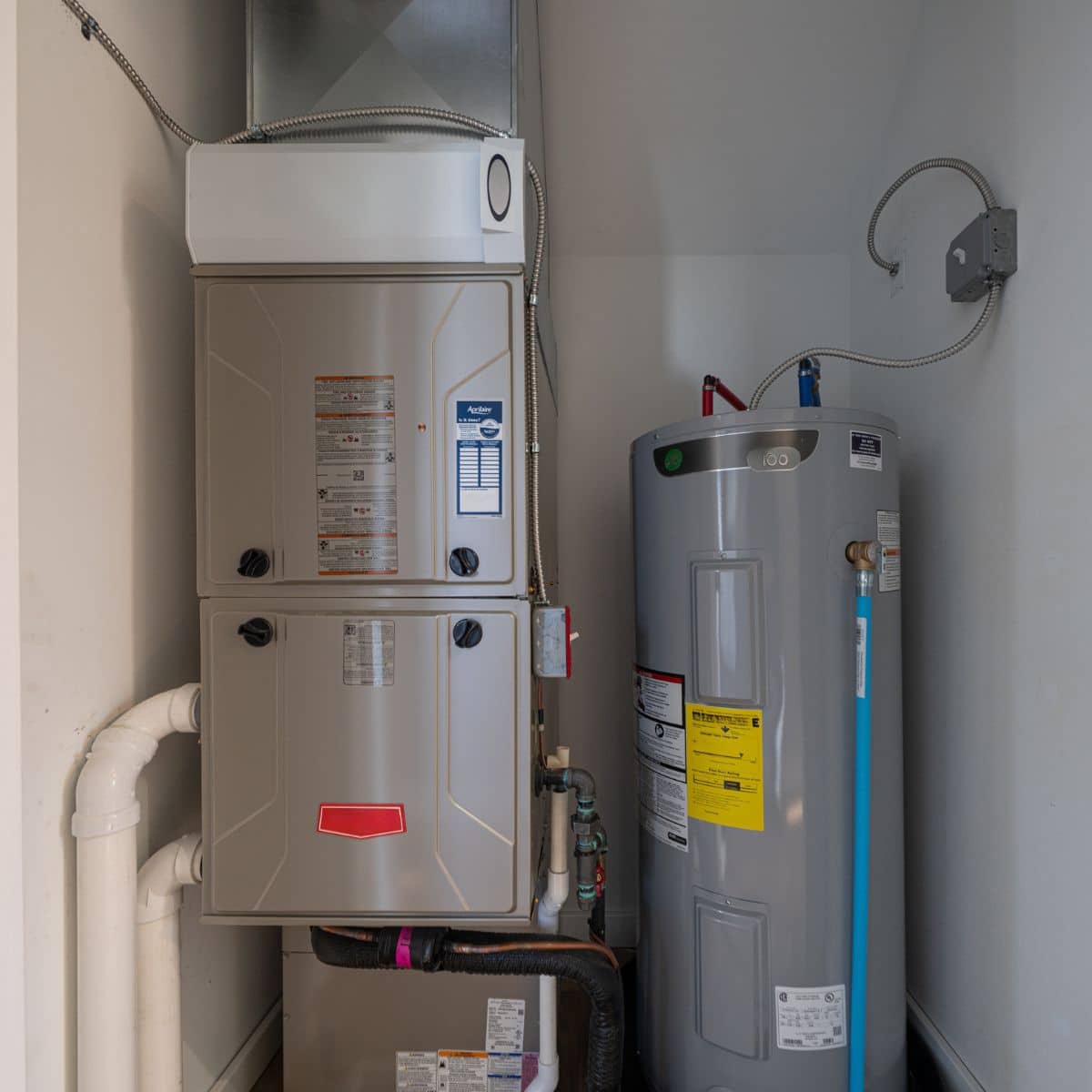 Service Squad Plumbing professional installing water heater