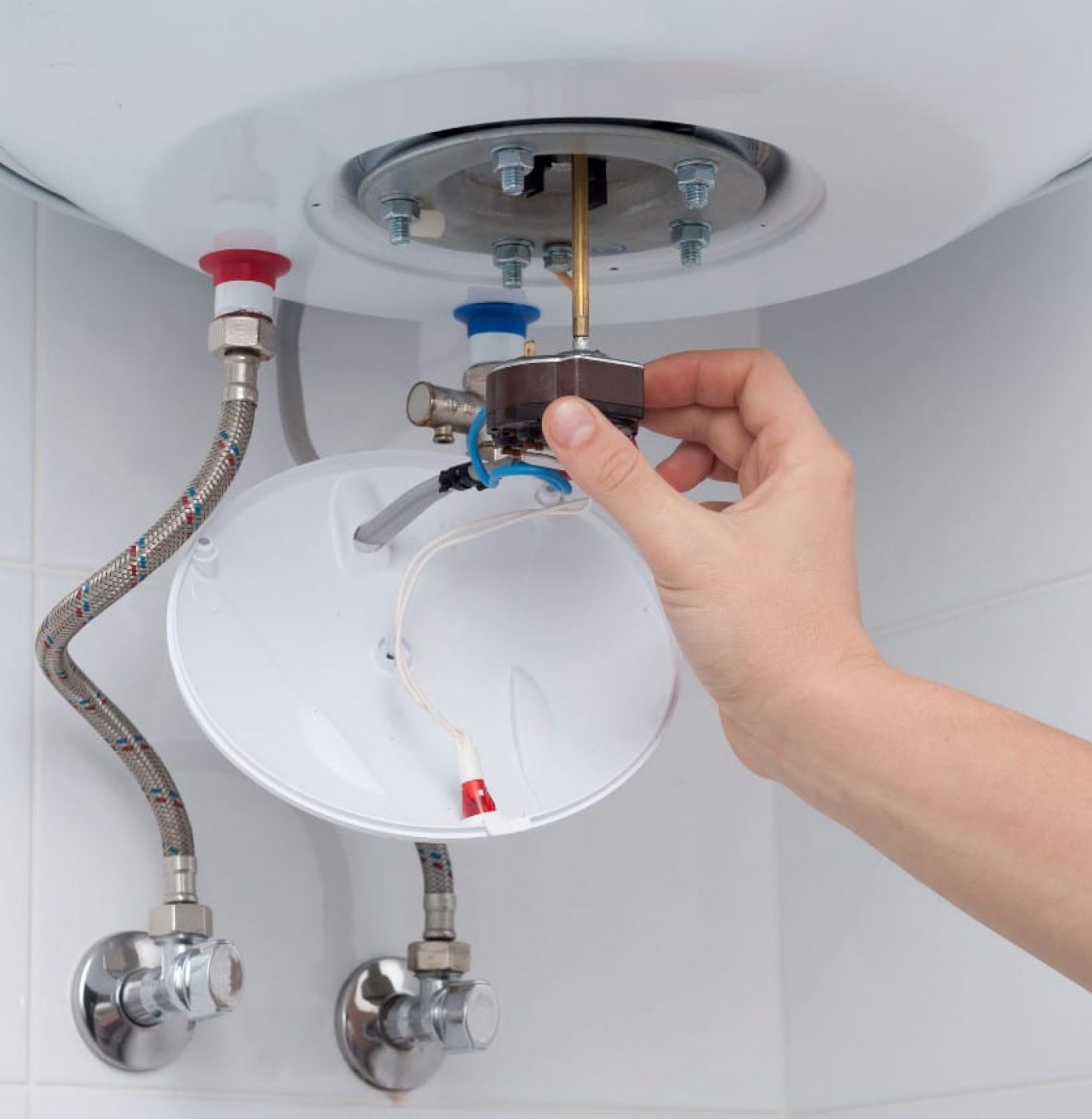 Service Squad Plumbing water heater repair technician inspecting tank