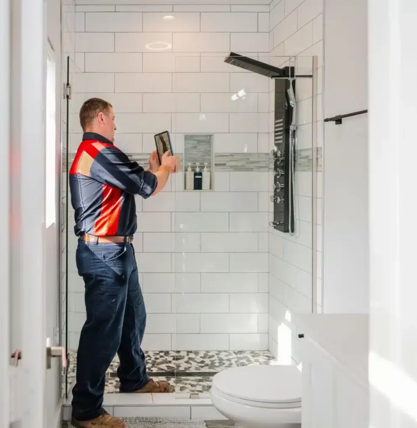 Service Squad Plumbing technician installing new fixtures