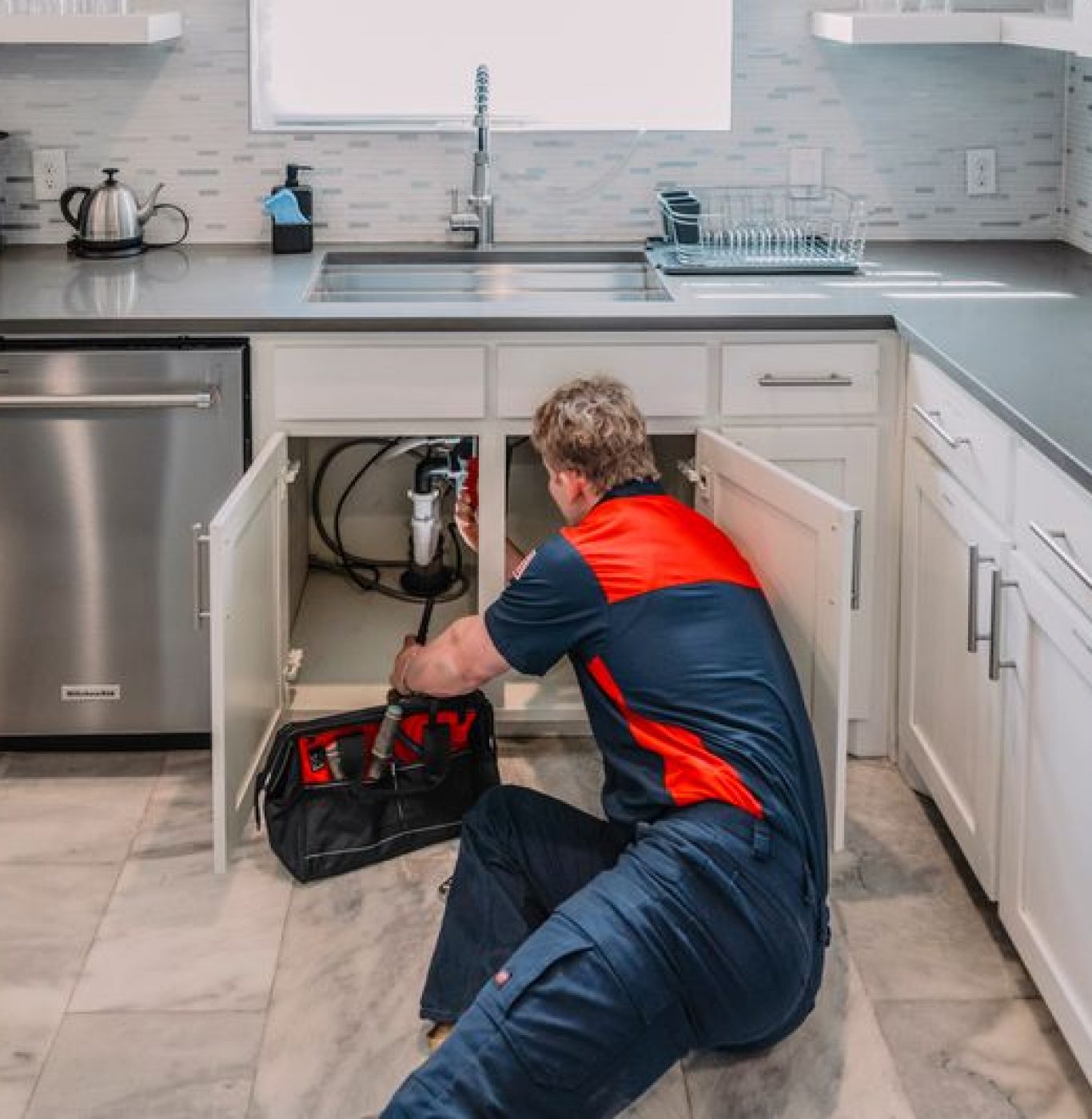 Expert plumber diagnosing a hidden water leak using specialized equipment in Burleson home