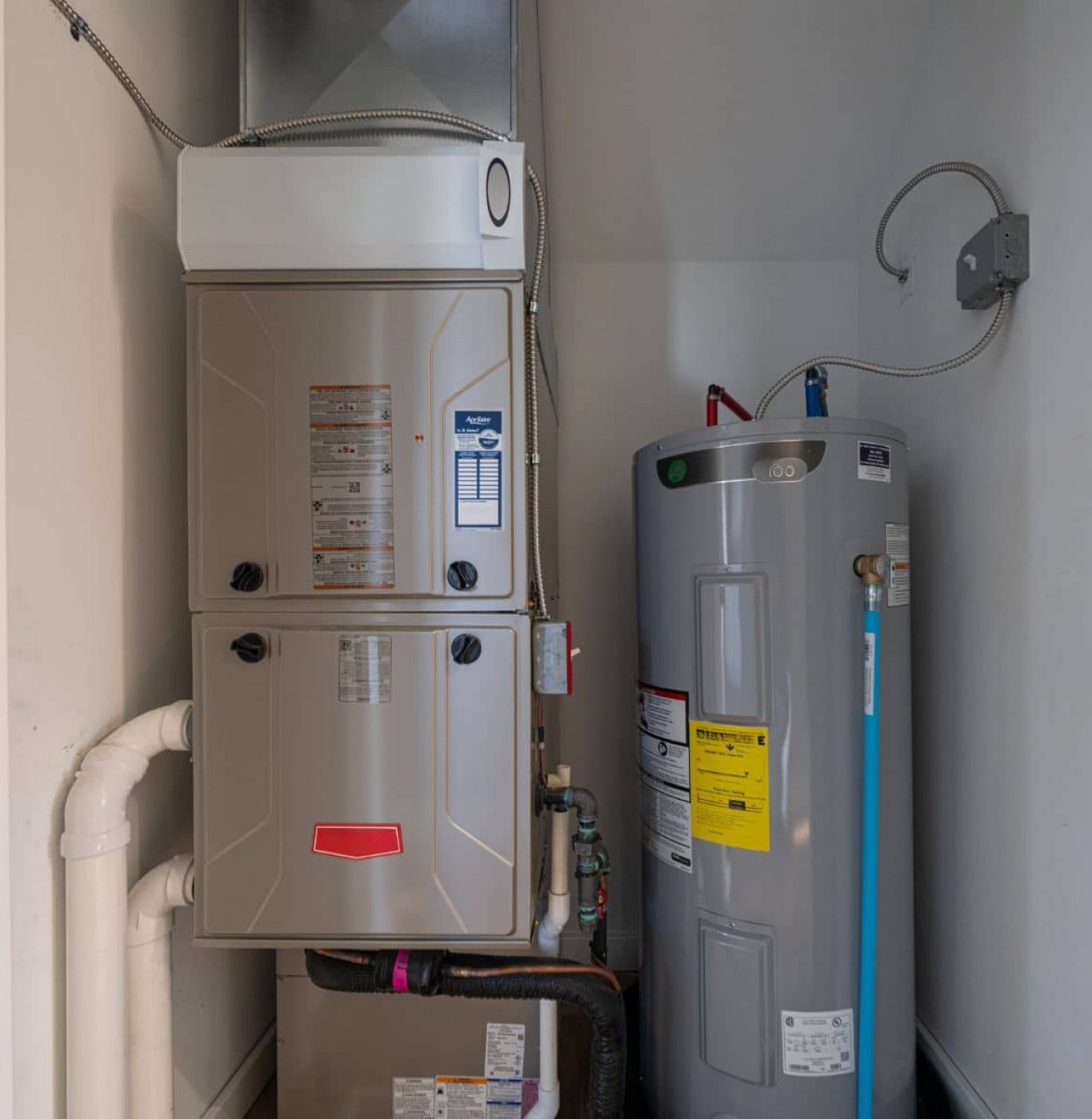 Service Squad Plumbing professional installing water heater